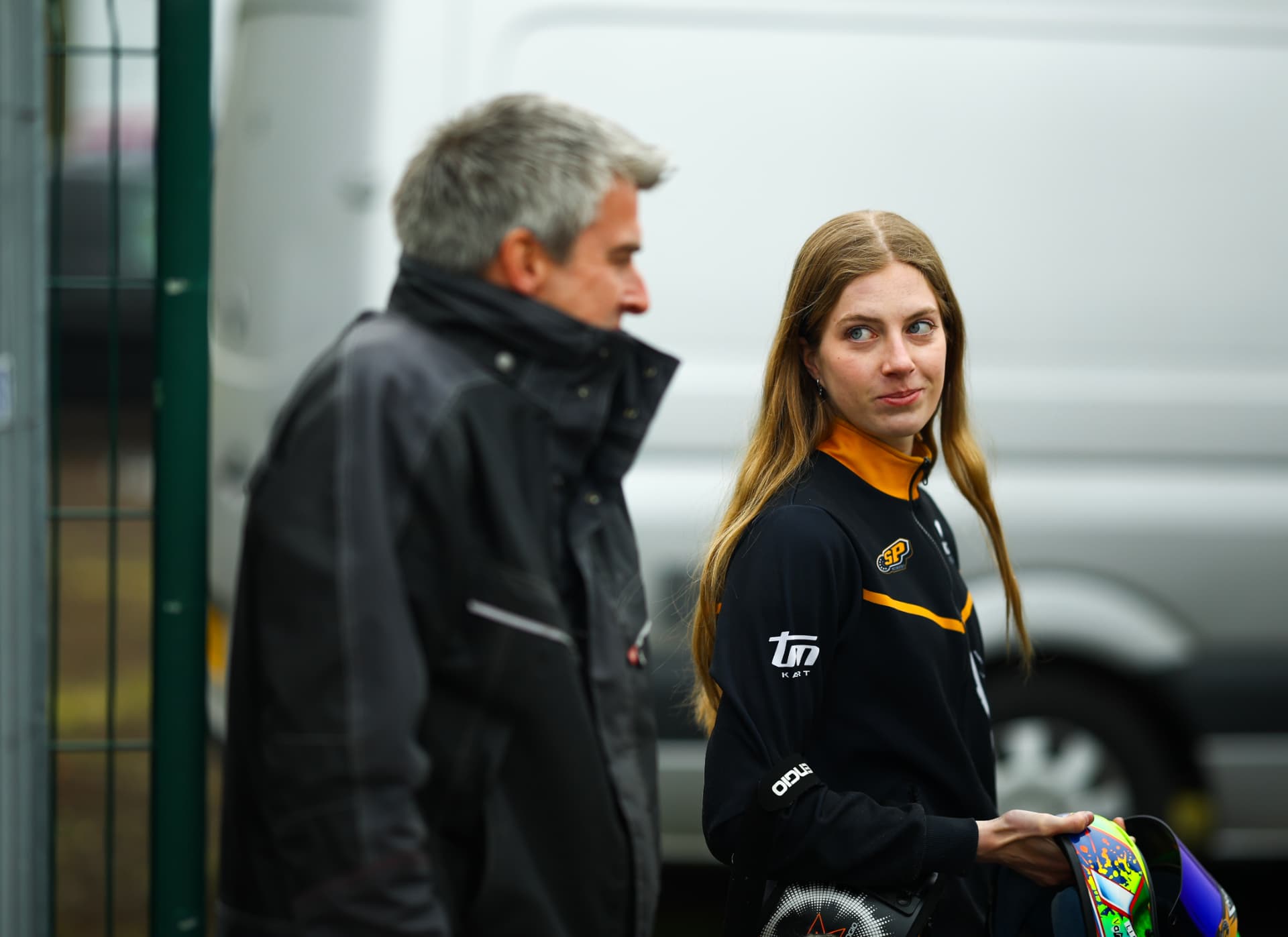 Lieke van Boekel looking over her shoulder next to her father